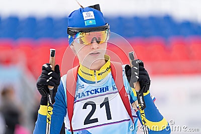 Portrait sportswoman biathlete Kryukova Arina Kazakhstan after skiing and rifle shooting. Open regional youth biathlon Editorial Stock Photo