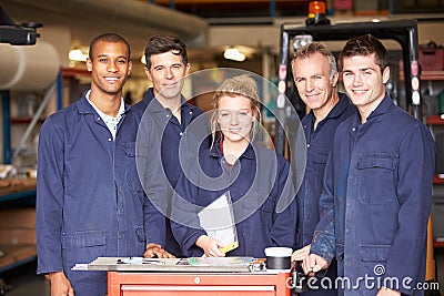 Portrait Of Staff Standing In Engineering Factory Stock Photo