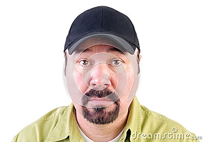 Portrait of staring man wearing baseball cap Stock Photo