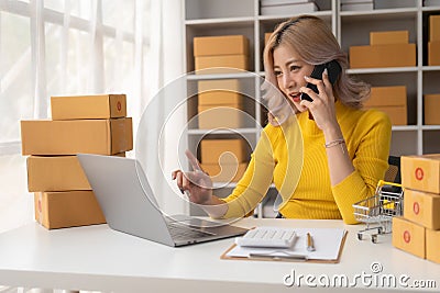 Portrait of Starting small businesses SME owners female entrepreneurs working on receipt box Stock Photo