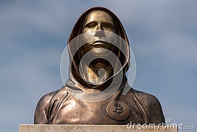 Portrait of the statue of Satoshi Nakamoto mysterious founder of Bitcoin Editorial Stock Photo