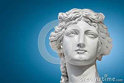 Portrait of a statue of young beautiful sensual Renaissance Era women in Vienna at smooth gradient blue background, Austria Stock Photo