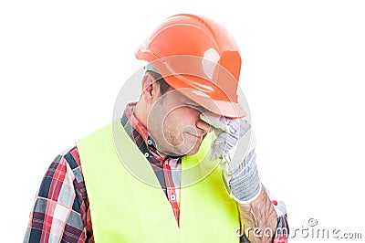 Portrait of stressed male builder looking upset Stock Photo