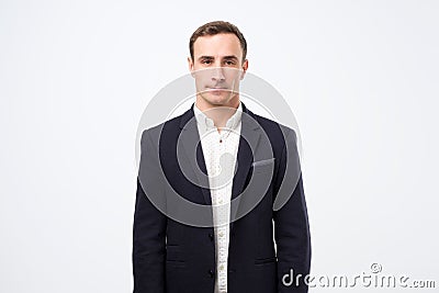 Portrait of strict serious businessman in black suit Stock Photo