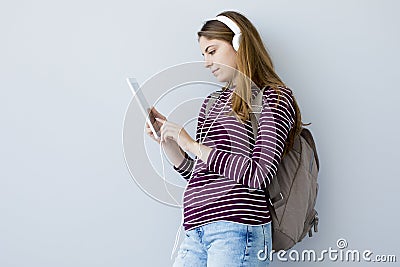 Portrait student girl using digital tablet Stock Photo