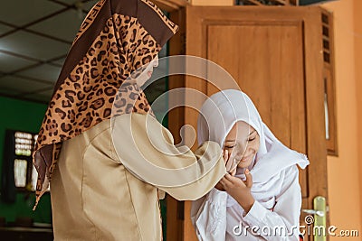 Portrait of students kissing the teacher`s hand Stock Photo