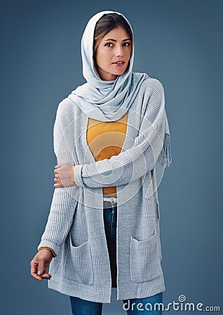 Portrait, studio and fashion with arab woman, clothes for Ramadan with modesty for religion and faith. Eco friendly Stock Photo