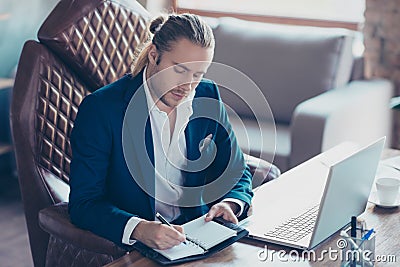 Portrait of stunning busy rich director sitting at his desk in w Stock Photo