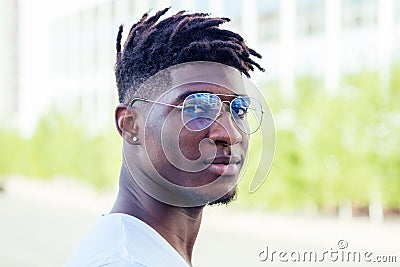 Portrait stylish and handsome African student American man with cool dreadlocks and earringin the ear diamond fashion Stock Photo