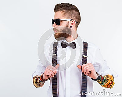 Portrait of a stylish hipster holding his suspenders Stock Photo