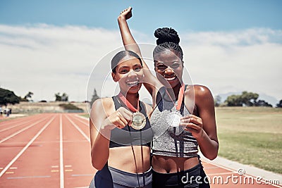 Portrait, success medals and women at stadium after winning running race or sports event outdoors. Fitness, winner and Stock Photo