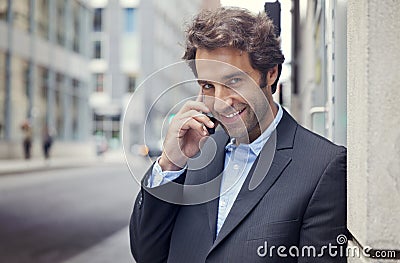 Portrait Of A Successful Businessman Smiling At The Camera Stock Photo