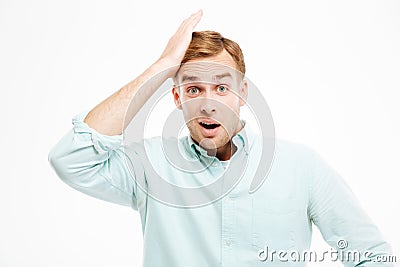 Portrait of surprised handsome young businessman with mouth opened Stock Photo