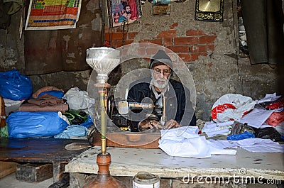 Portrait of a Tailor in the Famous Food Street, Lahore, Pakistan Editorial Stock Photo