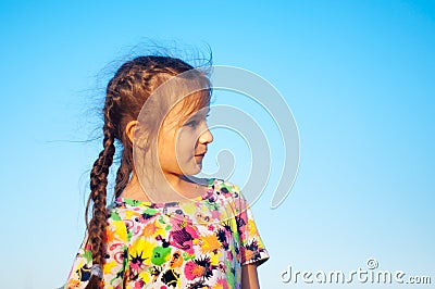 portrait of tanned five girls Portrait Portrait of a tanned little girl in a sundress by the sea Stock Photo