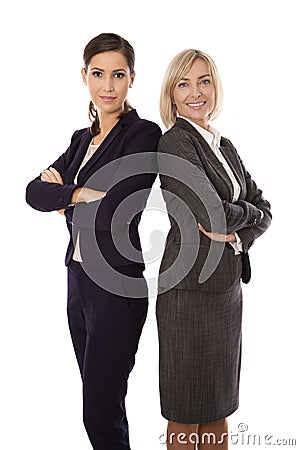 Portrait: Team of two isolated smiling and successful businesswoman in business outfit. Stock Photo