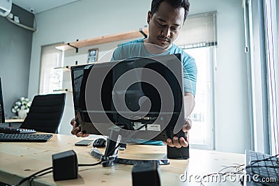 Portrait of technician install a new hardware a part of personal computer Stock Photo