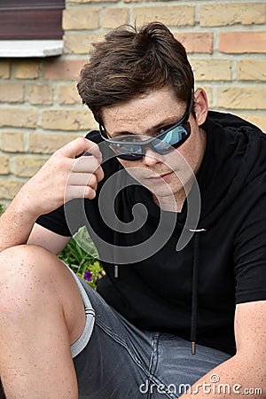 Teenage boy with modern sunglasses Stock Photo