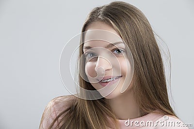 Portrait of Teenage Female Having Teeth Brackets. Posing with Smile Stock Photo