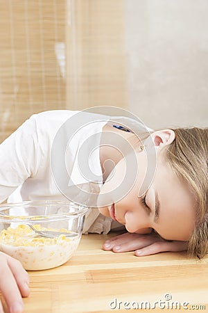 Portrait of Teenager Girl Sleeping on Table Surface Stock Photo