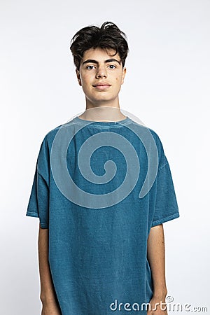 Portrait of teenager on white background in studio. The boy is standing Stock Photo