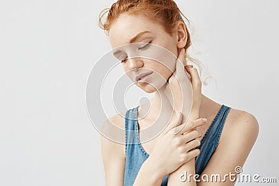 Portrait of tender redhead model posing with closed eyes. Stock Photo