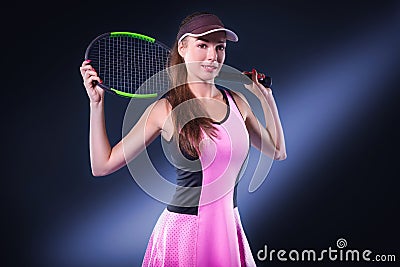 Portrait of a tennis player in a pink dress against the background of a sports arena. Olympic Games concept Stock Photo