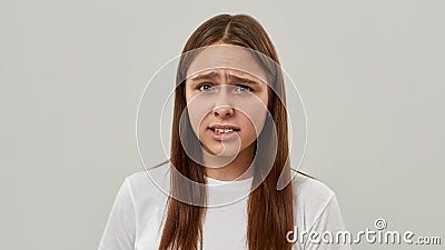 Portrait of tense girl teenage with skeptical face Stock Photo