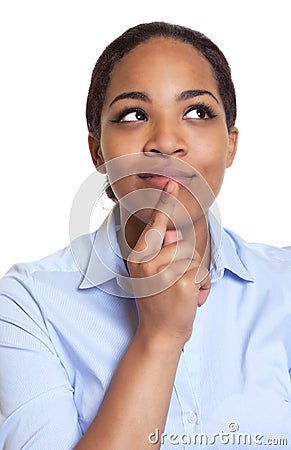 Portrait of a thinking african woman in a blue shirt Stock Photo