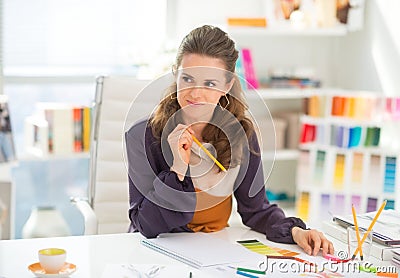 Portrait of thoughtful fashion designer in office Stock Photo