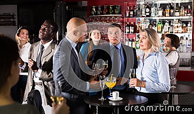 Three colleagues talking on party Stock Photo