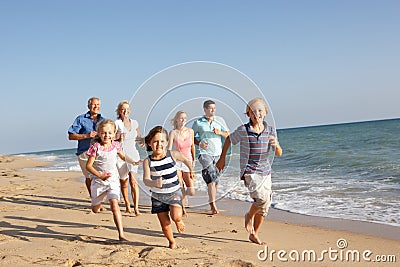 Portrait Of Three Generation Family On Beach Stock Photo
