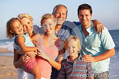 Portrait Of Three Generation Family On Beach Stock Photo