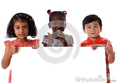 Portrait three of multiracial kids in studio with white board.Isolated Stock Photo