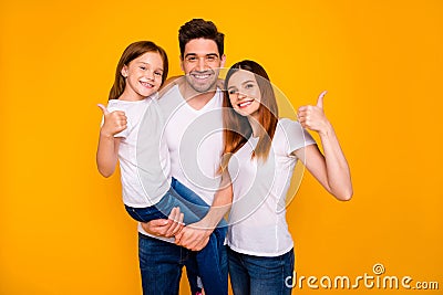 Portrait of three nice attractive charming cute lovely sweet cheerful cheery person showing thumbup cool good solution Stock Photo