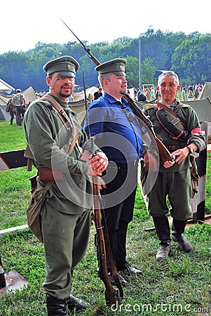 Portrait of three soldiers-reenactors in historical costumes. Editorial Stock Photo