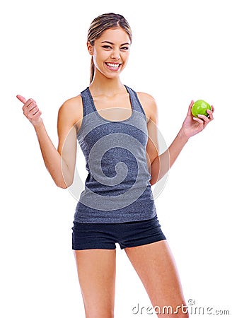 Portrait, thumbs up and woman with smile, apple and nutrition isolated on a white studio background. Person, mockup Stock Photo