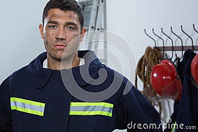 Tiered fireman standing in the office Stock Photo