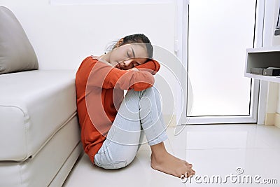 Portrait of tired asian woman sitting and falling asleep Stock Photo