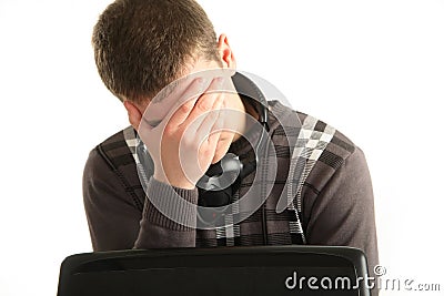 Portrait of tired businessman using laptop, eye fatigue Stock Photo