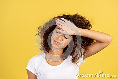 Adult afro american woman on yellow copy space background Stock Photo