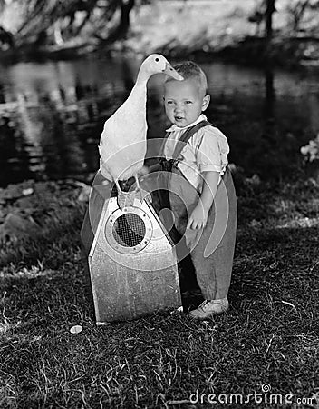 Portrait of toddler with duck Stock Photo