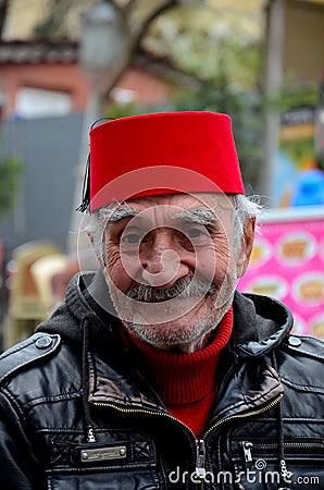 Portrait of Turkish senior wears Fez and leather jacket smiles Editorial Stock Photo