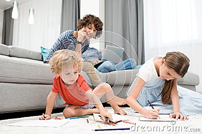 Mother Watching Kids at Home Stock Photo