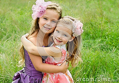 Portrait of two embracing cute little girls Stock Photo