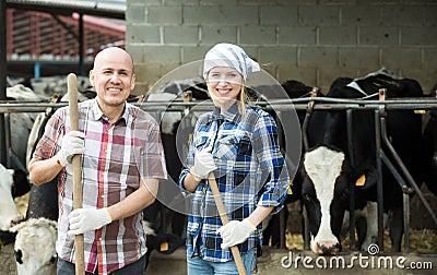 Portrait of two farmers near cows barn Stock Photo