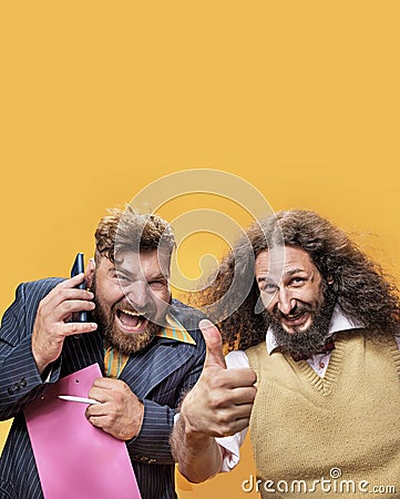Portrait of a two geeks in an office circumstances Stock Photo