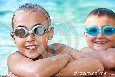 Kids in swimming pool with goggles. Stock Photo