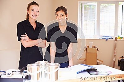 Portrait of two women from an interior decorating team Stock Photo