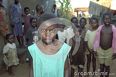 Portrait of Ugandan girl with friends in background Editorial Stock Photo